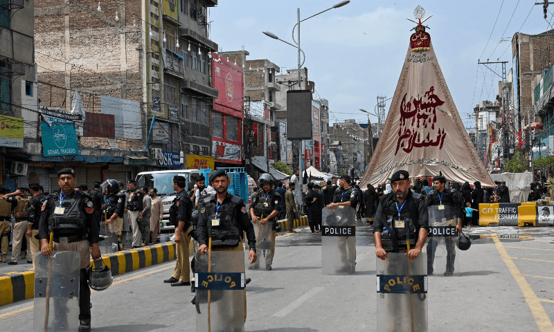 Muharram 9 processions under way across country amid tight security . Muh